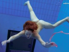 Find-Best-Pussy.com presents: Curly hair redhead swims and looks sexy