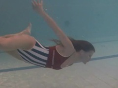 Find-Best-Pussy.com presents: Leggy girl swims and strips naked in pool